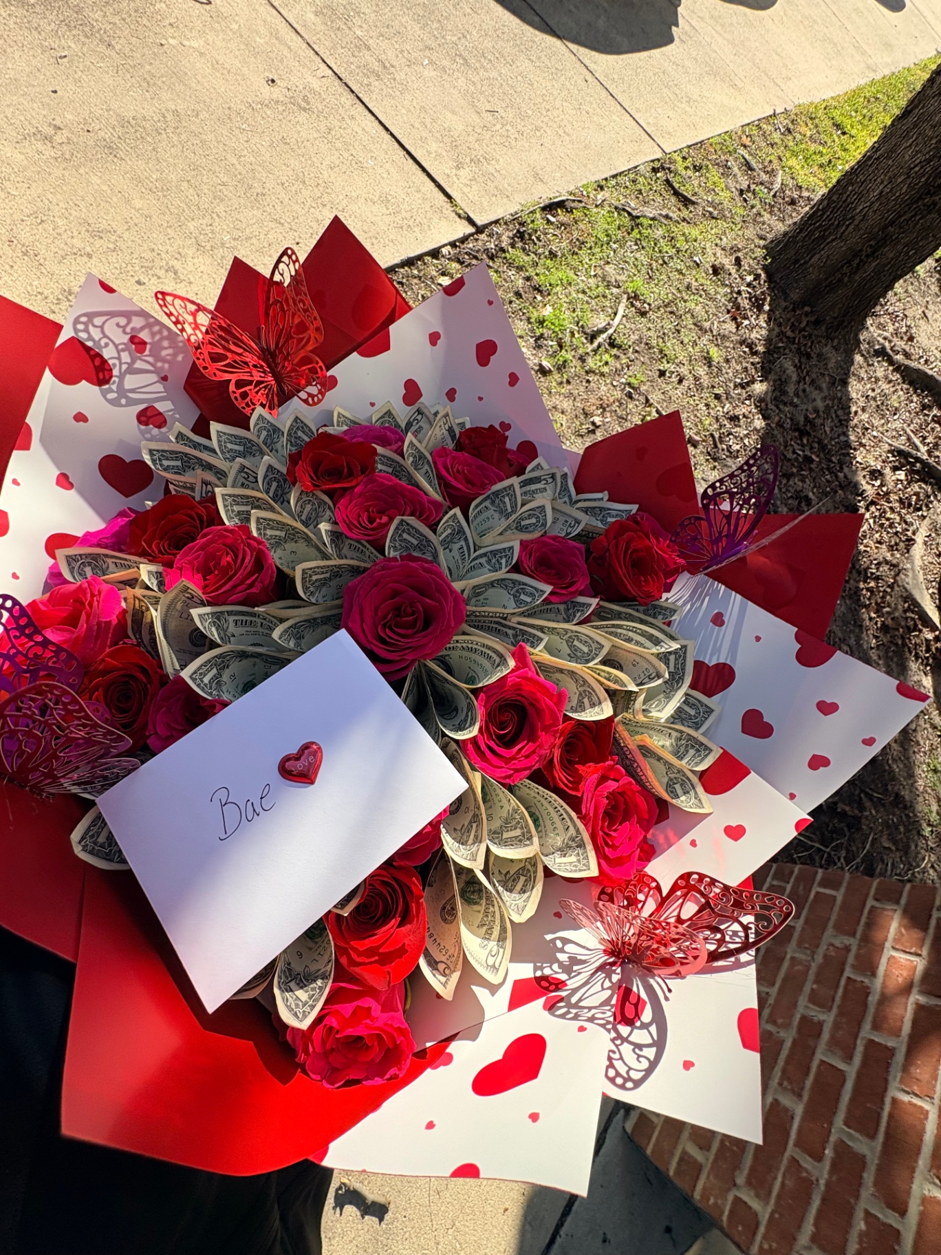 Valentine money bouquet with red and hot pink roses