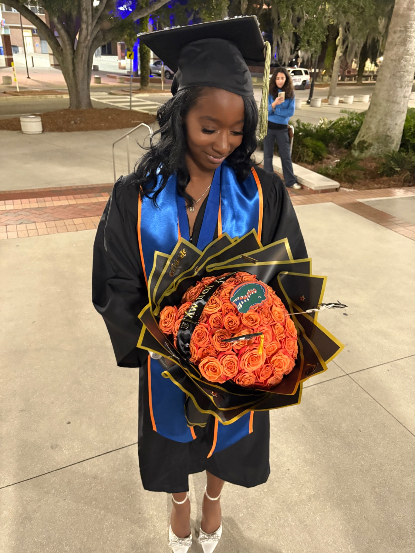 Graduation bouquet with orange roses and Gators detail