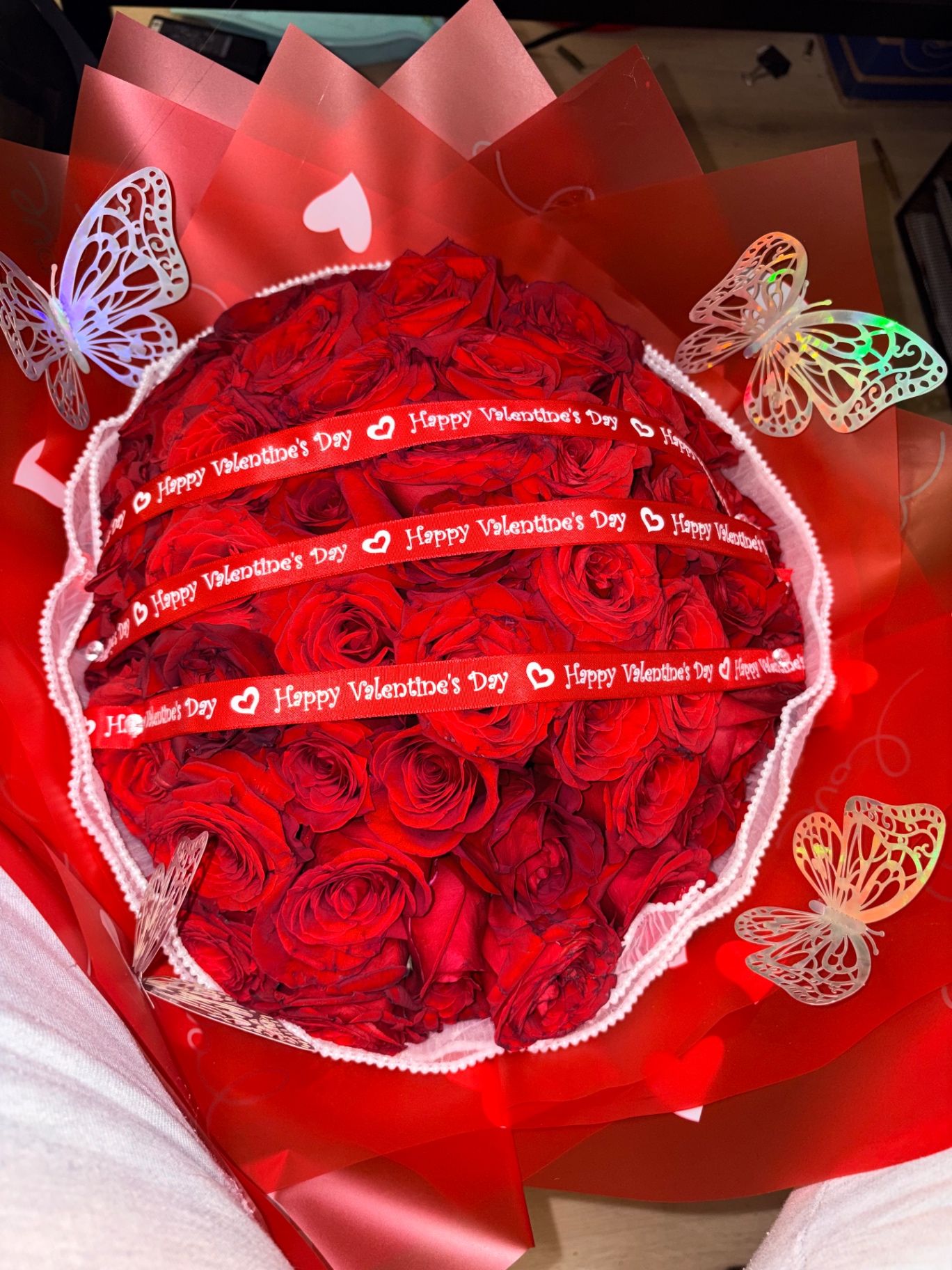 Red Valentine dome bouquet with butterfly accents